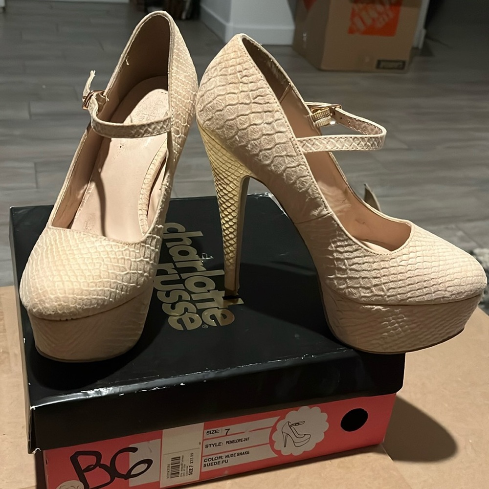 Platform. 5 inch heel. Color is between cream & light pink.
